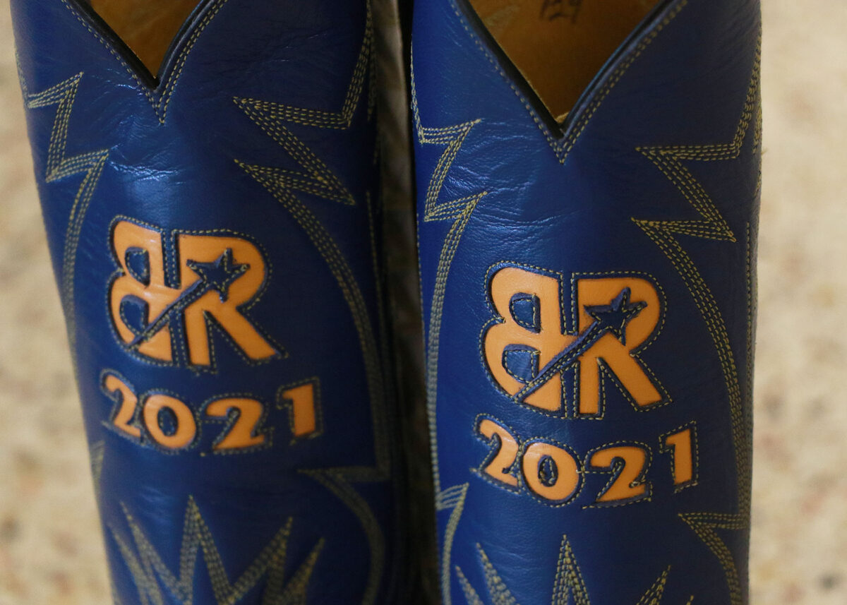 Boys Ranch logo on a pair of blue boots