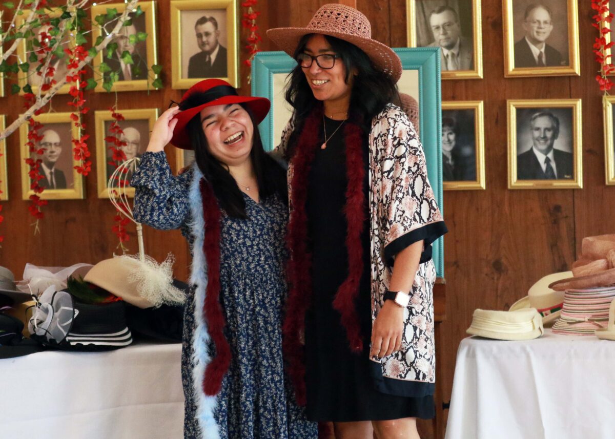 a girl and a staff member at the senior tea party