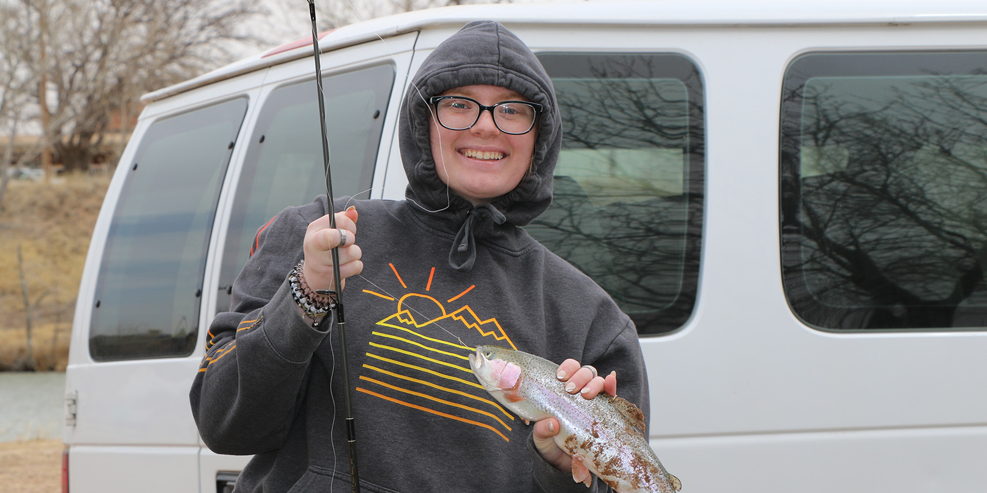 girl holding a fish