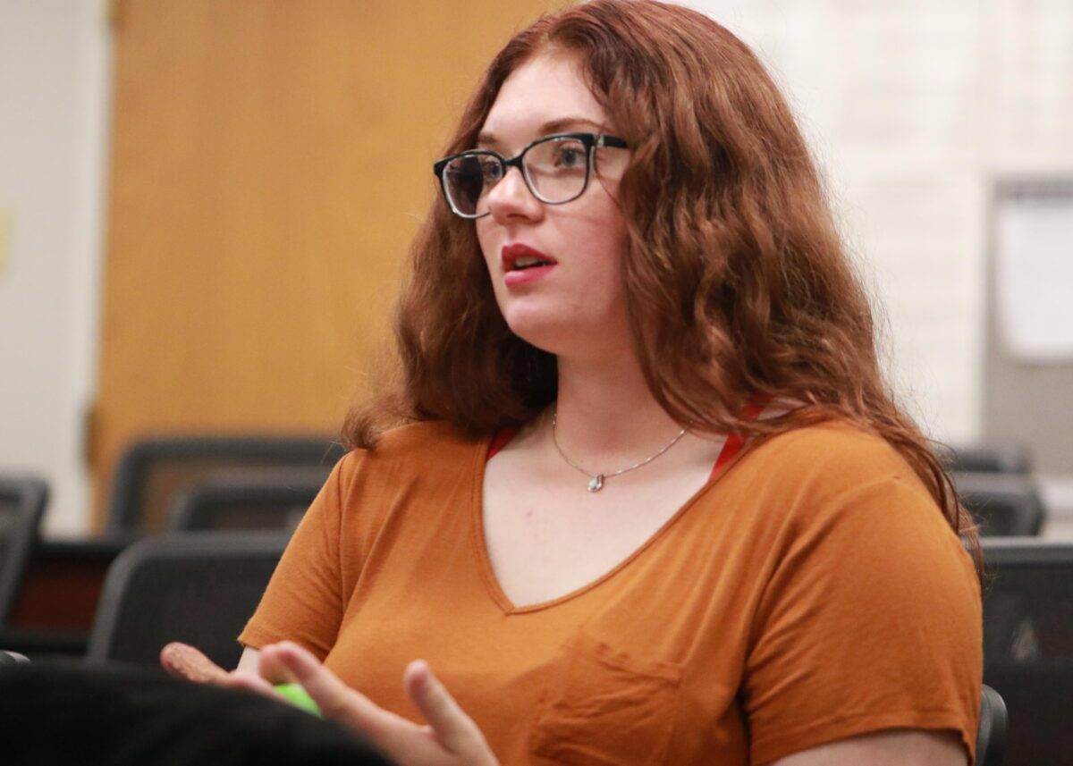Sarah listens during a class.