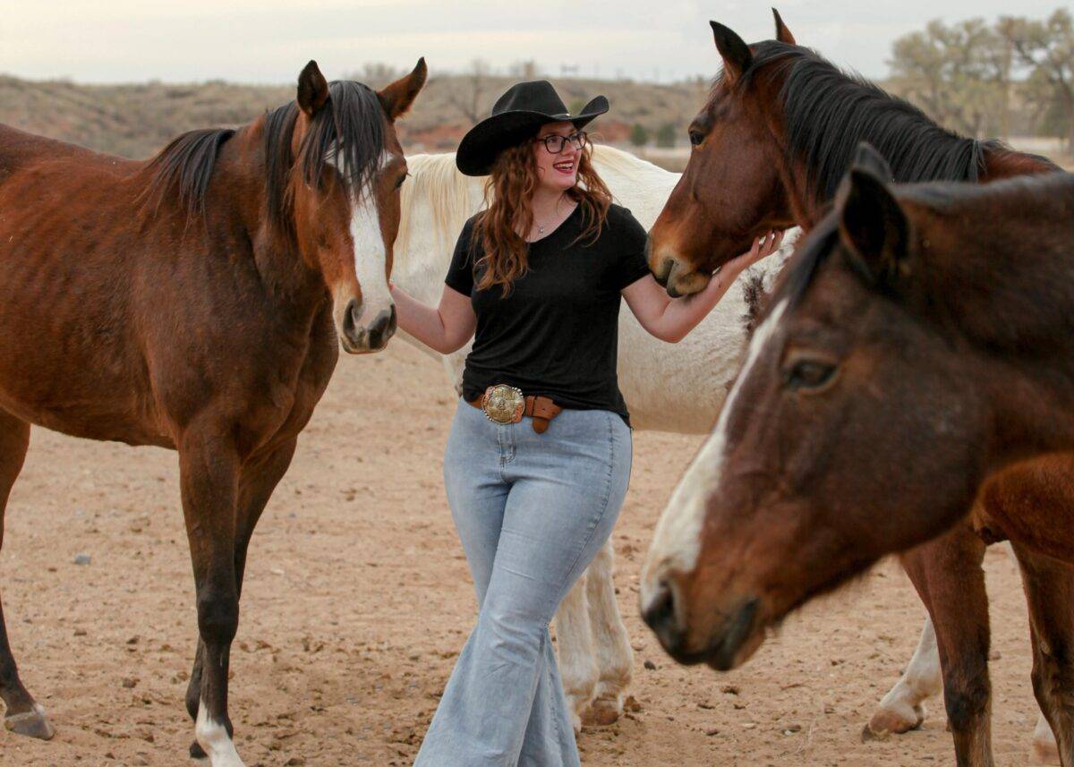 Sarah spends time with the Boys Ranch horse herd.