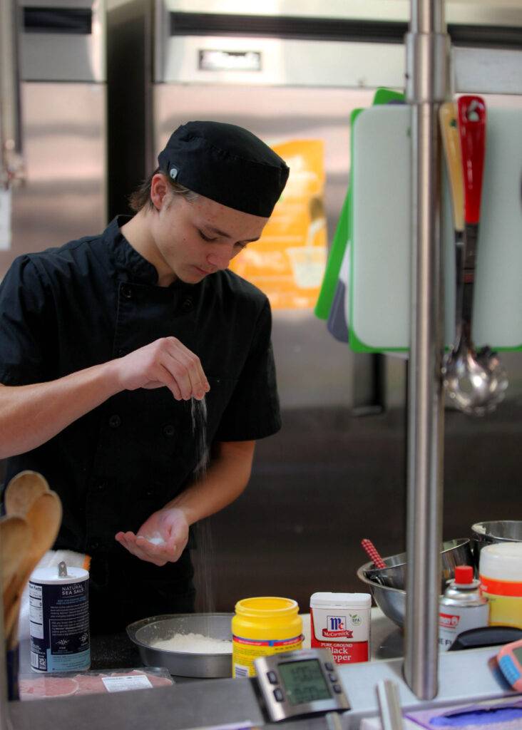 Josh practices his cooking skills in the culinary lab at Boys Ranch High School.