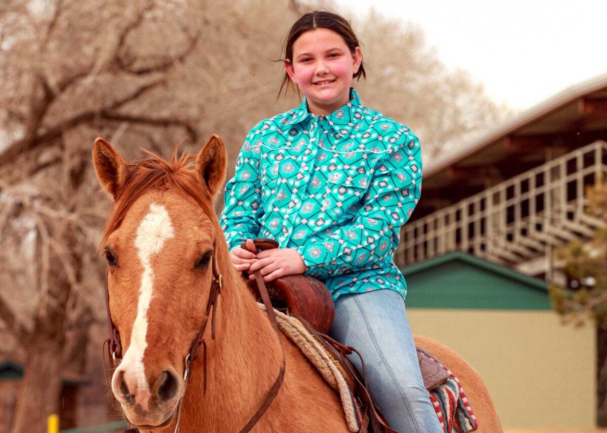 Alexis practices riding a horse.