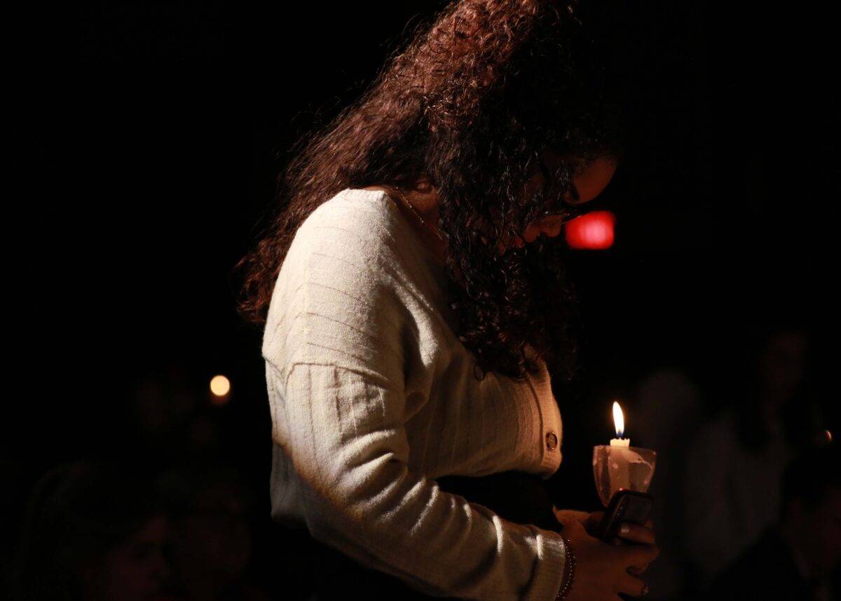 a girl prays in chapel